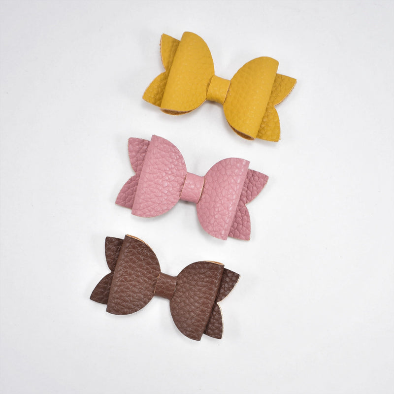 mustard, dusty pink and brown leather bows